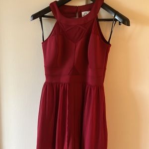 Red dress with shorts & long see through at bottom.Sleeveless.Buttons on back.